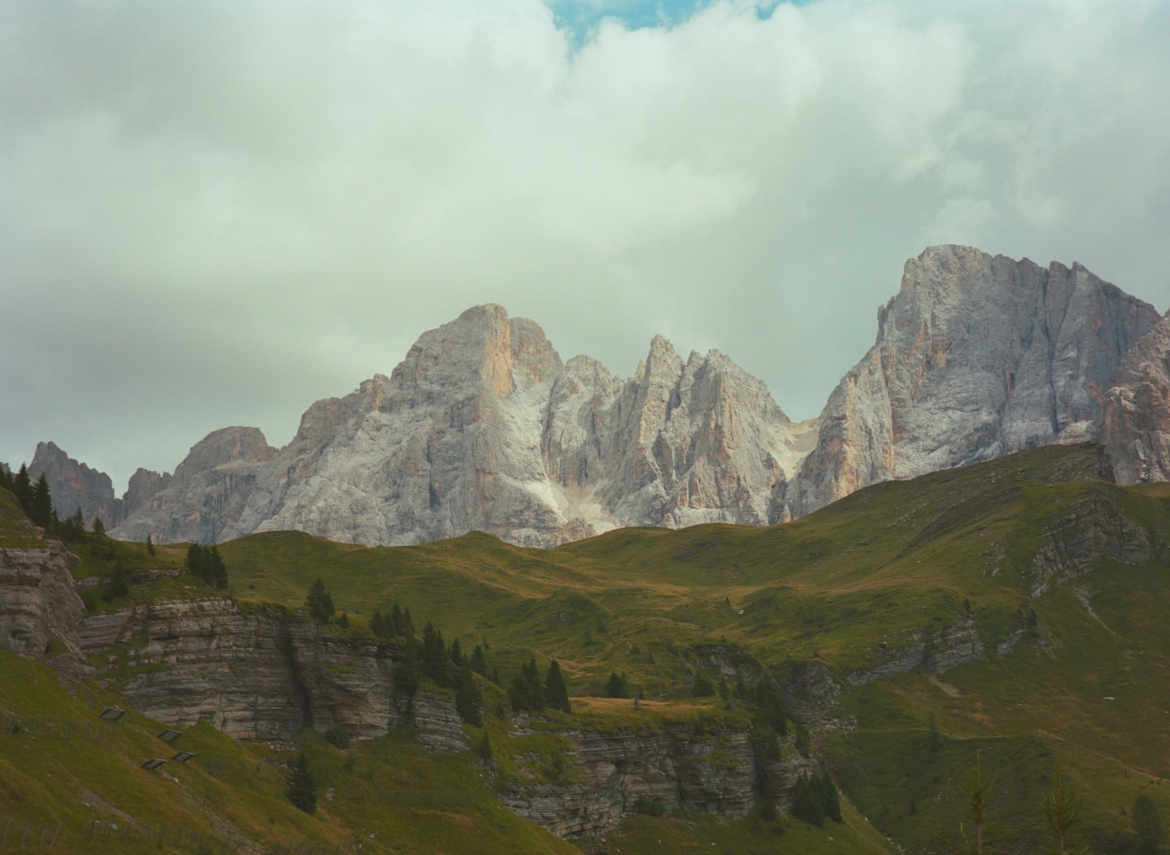 Jagged limestone peaks of the Dolomites beneath a cloudy sky in South Tyrol, Italy